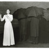Martha Scott standing in front of unidentified actors in Our Town.