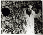 Charles Ludlam wearing bloody lab coat.