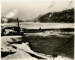 Lillian Gish and Richard Barthelmess on the ice with Billy Bitzer and D.W. Griffith on the bridge shooting a scene from the silent motion picture Way Down East