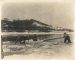 The crew pushing Lillian Gish on cake of ice out into the flow of the river while shooting a scene from the silent motion picture Way Down East
