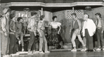 Chita Rivera as Anita confronts the Jets gang (pictured includes Lee Becker, David Winters, Tony Mordente, and Art Smith) in the stage production West Side Story