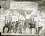 Philip Loeb and unidentified cast holding picket signs in a scene from Let 'Em Eat Cake