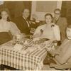 Lucille Lortel (wearing white jacket draped on her shoulders) and unidentified people