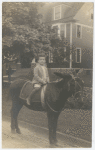 Lincoln Kirstein as a child sitting on a mule, Rochester, N.Y.