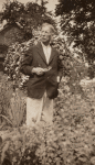 Frank J. Sprague standing in Harriet Ford's garden, Milford, Connecticut