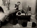 Lionel Mapleson with Edison Home Phonograph and extra large horn, probably at the Metropolitan Opera House