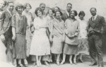 Guests at breakfast party for Langston Hughes hosted by Regina Anderson (Andrews) and Ethel Ray at 580 St. Nicholas Avenue, Harlem, May 1925. Back row, left to right: Ethel Ray (Nance), Langston Hughes, Helen Lanning,Pearl Fisher, Rudolf Fisher, Luella Tucker, Clarissa Scott, Hubert Delany. Front row, left to right: Regina Anderson (Andrews), Esther Popel, Jessie Fauser, Marie Johnson and E. Franklin Frazier.