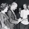 Robert C. Weaver signing autographs after receiving the National Association for the Advancement of Colored People's Spingarn Award, in Atlanta, Georgia, July 1962