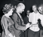 Robert C. Weaver signing autographs after receiving the National Association for the Advancement of Colored People's Spingarn Award, in Atlanta, Georgia, July 1962