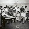 Group portrait of members of the American Negro Theatre including Sidney Poitier (4th from left), Robert Earl Jones, seated (3rd from right), and Hilda Haynes, seated, middle.