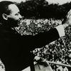 Dr. Martin Luther King, Jr. waving to the crowd from the steps of the Lincoln Memorial during the March on Washington
