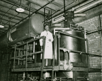 Dr. Percy L. Julian, scientist, checking equipment in the Glidden Paint and Varnish plant, Chicago, Illinois