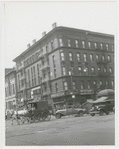 View of the northwest corner of West 135th Street and Lenox Avenue, with the West 135th Street Branch of The New York Public Library (Schomburg Center) at left, 1920s