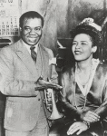 Billie Holiday with Louis Armstrong in publicity photograph for the 1947 film "New Orleans."