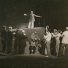 Norman Lloyd (center below demagogue on pedestal) and cast in the stage production Julius Caesar