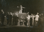 Norman Lloyd (center below demagogue on pedestal) and cast in the stage production Julius Caesar