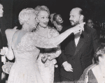 Marlene Dietrich (center) between unidentified woman and man.