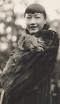 Anna May Wong holding baby koala