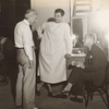 John M. Stahl, Robert Taylor and Charles Butterworth behind-the-scenes during filming of the motion picture Magnificent Obsession.