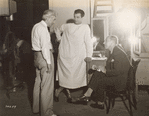 John M. Stahl, Robert Taylor and Charles Butterworth behind-the-scenes during filming of the motion picture Magnificent Obsession.