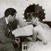 Robert Taylor and Barbara Stanwyck backstage in dressing room on the set of the motion picture This Is My Affair