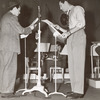 Unidentified actor and Robert Taylor during rehearsal for an episode of NBC's radio program Good News of 1938
