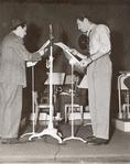Unidentified actor and Robert Taylor during rehearsal for an episode of NBC's radio program Good News of 1938