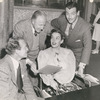 Robert Taylor (standing at right) with unidentified cast members