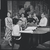 Carol Lawrence, Stephen Sondheim, Leonard Bernstein and unidentified cast members around the piano rehearsing for West Side Story.