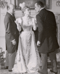 Jack Raine, Eileen Peel, and Basil Rathbone in the stage production Sherlock Holmes