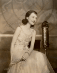 Publicity photograph of Lee Morse with a CBS microphone