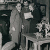 Director George Cukor examining script with Robert Mitchun and Greer Garson on the set of the motion picture Desire Me