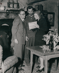 Director George Cukor examining script with Robert Mitchun and Greer Garson on the set of the motion picture Desire Me