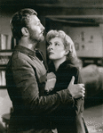 Pobert Mitchum and Greer Garson in the motion picture Desire Me