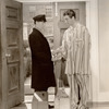 Unidentified actor and Robert Taylor in the motion picture Personal Property