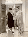 Unidentified actor and Robert Taylor in the motion picture Personal Property