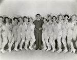 Publicity photo of Robert Taylor and chorus girls in This is My Affair