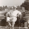 William Boyd sitting on car.