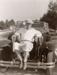 William Boyd sitting on car.