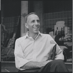 Jerome Robbins sitting on chair during rehearsal for West Side Story.