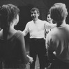 Leonard Bernstein (with Carol Lawrence in background) instructing cast during rehearsal for West Side Story.