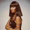 Head and shoulders shot of model wearing straight darkshoulder-length Egyptian style wig beaded dress with Egyptian broach between breats red and gold armbands and lion collar