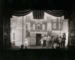 Setting design by Mordecai Gorelik for Processional with June Walker as Sadie (in white dress blowing trumpet)