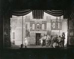 Setting design by Mordecai Gorelik for Processional with June Walker as Sadie (in white dress blowing trumpet)