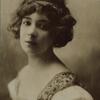 Thamara de Svirsky, half portrait, wearing embroidered bodice with puff sleeves.