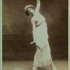 Thamara de Svirsky standing in fourth position, facing sideways, upper torso twisted towards front