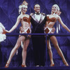 Actresses Colleen Dunn (L) and Wendy Waring (R) standing beside actor Peter Allen in a scene from the play "Legs Diamond"