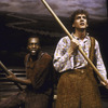 Daniel H. Jenkins as Huckleberry Finn (R) and Ron Richardson as runaway slave Jim (L) in musical "Big River"