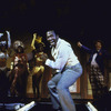 Ben Vereen singing, with line of dancers behind him, in musical.