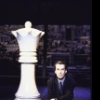 Director Des McAnuff next to giant chess piece in publicity shot from the National tour of the Broadway musical "Chess" (Miami)